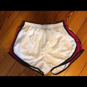 white and pink nike shorts